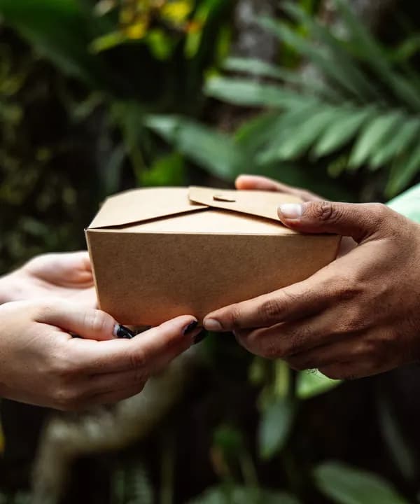 A parcel handed from one person to another